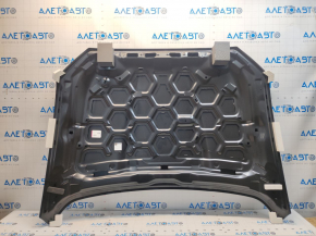 The hood of a Ford Fusion mk5 13-20 aluminum is bare, with dents on the edges.