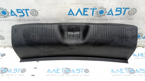The trunk opening trim of a 1996 Dodge Dart is worn and scratched.