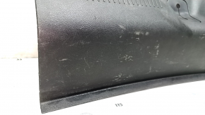 The trunk opening trim of a 1996 Dodge Dart is worn and scratched.