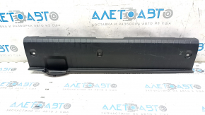 The trunk opening trim of a Subaru Legacy 15-19 is worn and scratched.