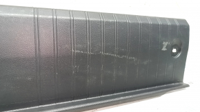 The trunk opening trim of a Subaru Legacy 15-19 is worn and scratched.