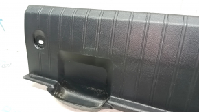The trunk opening trim of a Subaru Legacy 15-19 is worn and scratched.