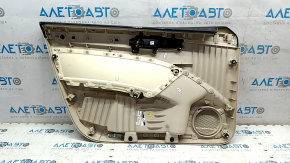 The front right door panel of the VW Passat b7 12-15 USA is beige, with a beige insert, the armrest is beige, dented, the fasteners are broken