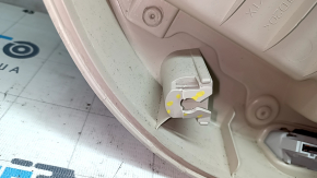 The front right door panel of the VW Passat b7 12-15 USA is beige, with a beige insert, the armrest is beige, dented, the fasteners are broken