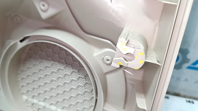 The front right door panel of the VW Passat b7 12-15 USA is beige, with a beige insert, the armrest is beige, dented, the fasteners are broken