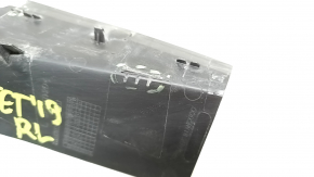 The outer wing light cover on the left VW Jetta 19-24 has broken fasteners.