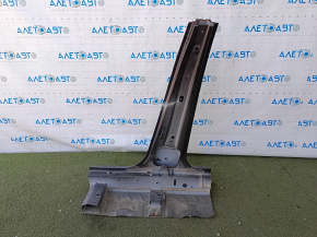 The center right body pillar of a Honda Civic X FC 16-21 4d is sawn off, dented, and dented.