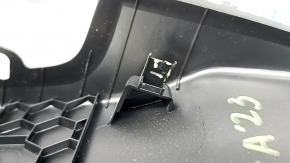 Black Ford Escape MK4 20-24 driver's knee pad with cracks in the mountings