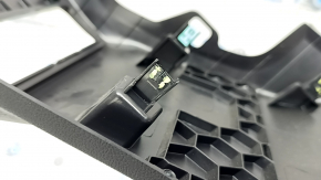 Black Ford Escape MK4 20-24 driver's knee pad with cracks in the mountings