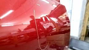 The front right door of a Toyota Prius 50 Prime 17-18 red 3T7 has dents and dings.