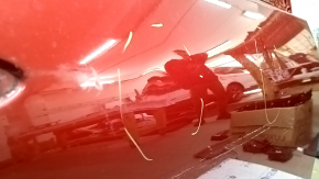 The front right door of a Toyota Prius 50 Prime 17-18 red 3T7 has dents and dings.