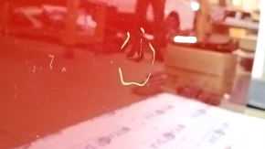 The front right door of a Toyota Prius 50 Prime 17-18 red 3T7 has dents and dings.
