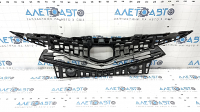 The radiator grille of a Toyota Prius V 15-17 rest is broken.