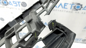 The radiator grille of a Toyota Prius V 15-17 rest is broken.
