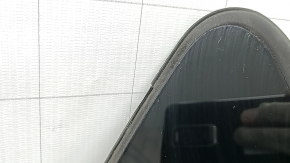 The rear left window of a Toyota Prius V 12-17 has a cut seal.