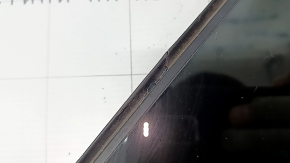 The front right window of a Toyota Prius V 12-17 has a cut seal.