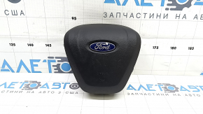 The driver's side steering wheel airbag for a Ford Edge 19-24 is black and has a rusty squib.