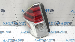 Left headlight of a 2015-2017 Toyota Prius V, cracks in the glass