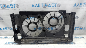 The bare radiator shroud diffuser of a Toyota Prius V 12-17 is broken.