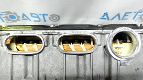 The Toyota Prius V 12-17 inverter has dented tubes.