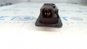 The internal trunk lid closing button on a Lincoln MKZ 13-14 has a worn-out icon.