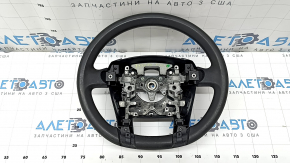 The steering wheel is bare, Toyota Prius V 12-17, black rubber, worn, needs cleaning, scrolls.