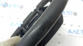 The steering wheel is bare, Toyota Prius V 12-17, black rubber, worn, needs cleaning, scrolls.