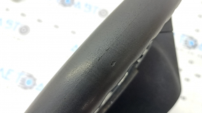 The steering wheel is bare, Toyota Prius V 12-17, black rubber, worn, needs cleaning, scrolls.