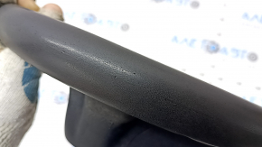 The steering wheel is bare, Toyota Prius V 12-17, black rubber, worn, needs cleaning, scrolls.