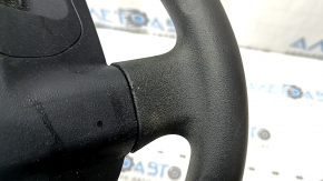 The steering wheel is bare, Toyota Prius V 12-17, black rubber, worn, needs cleaning, scrolls.