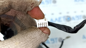 The steering wheel controls on the right side of a Toyota Prius V 2015-2017 have scratches and scuffs.