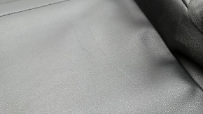Upper passenger seat trim for a 19-21 VW Jetta, black leather, scratches