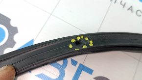 The rear left door seal of a Mitsubishi Outlander 22-25 has torn fasteners.