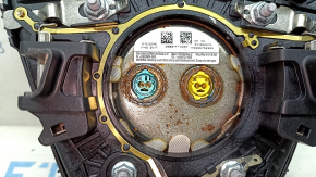 Black steering wheel airbag for the driver's side of a Ford Escape MK3 2017-2019, with a rusty squib.
