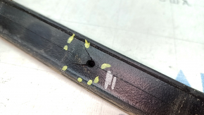 The left hood seal on a Ford Mustang mk6 18-23 is torn.