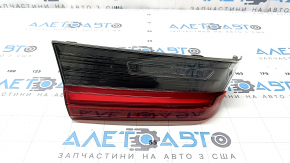 Left BMW 3 G20 22-25 trunk lid interior light, debris under the glass