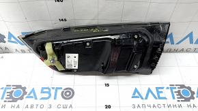 Left BMW 3 G20 22-25 trunk lid interior light, debris under the glass