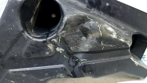 The right trunk bottom protection of the Ford Edge 15-23 AWD is dented and torn.