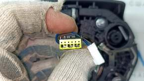 The steering wheel airbag for the driver's side of a BMW 3 G20 19-24 is black, with a rusty squib and scratches.