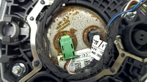 The steering wheel airbag for the driver's side of a BMW 3 G20 19-24 is black, with a rusty squib and scratches.