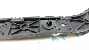 Rear bumper mount on the right fender of a Ford Mustang mk6 18-23 coupe, the mount is broken