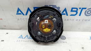 The steering wheel airbag on the driver's side of the Ford Mustang mk6 18 is rusty.