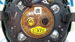 The steering wheel airbag on the driver's side of the Ford Mustang mk6 18 is rusty.