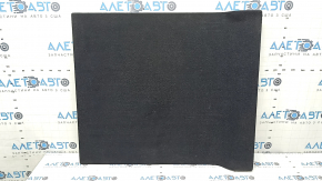 The trunk floor of a BMW 3 G20 19-25 black without a spare tire, needs cleaning.