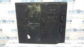 The trunk floor of a BMW 3 G20 19-25 black without a spare tire, needs cleaning.
