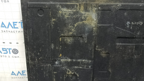 The trunk floor of a BMW 3 G20 19-25 black without a spare tire, needs cleaning.