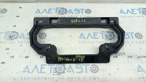 The rear bumper bracket, center, is broken on a Ford Mustang mk6 18-23.