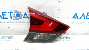The left inner tailgate light for a Nissan Rogue 17-20 is worn.