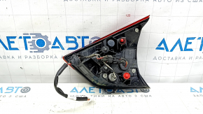 The left inner tailgate light for a Nissan Rogue 17-20 is worn.