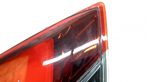 The left inner tailgate light for a Nissan Rogue 17-20 is worn.